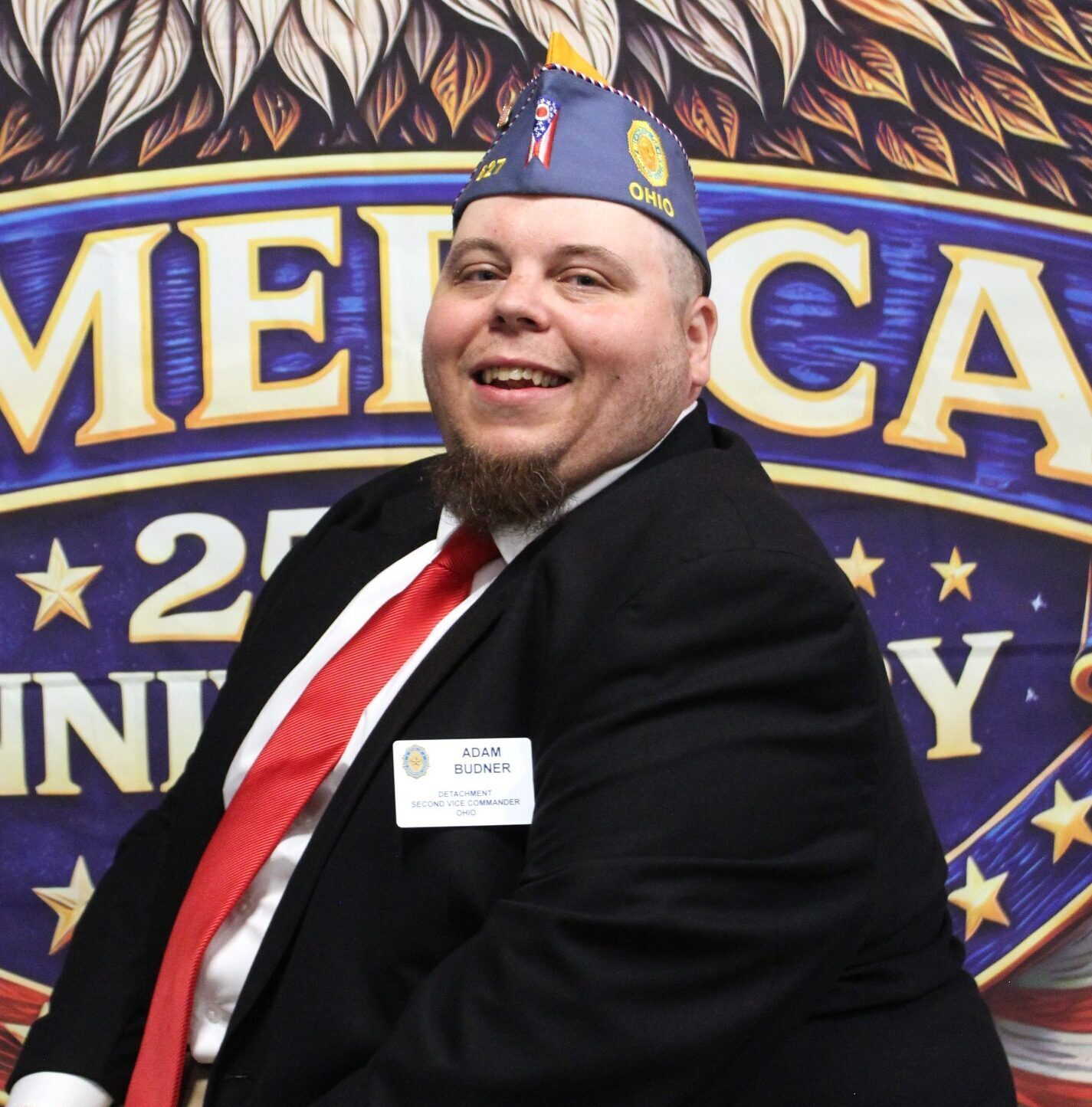 Adam J Budner